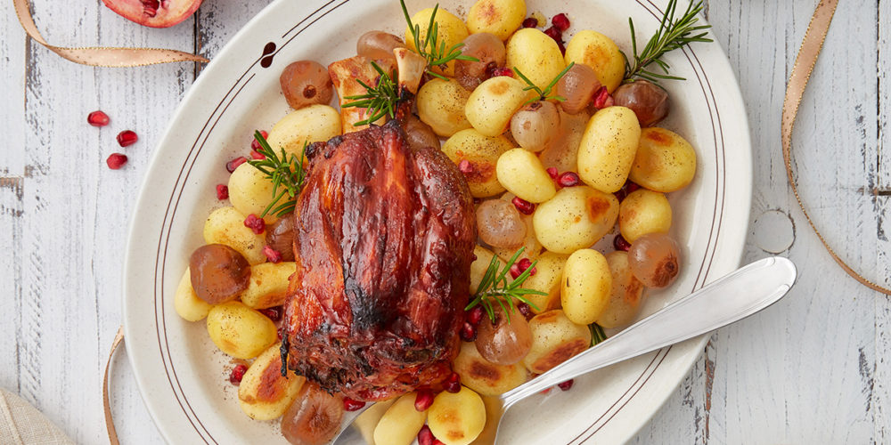 Recipe: Baked pork shank with spring onions, new potatoes and pomegranate